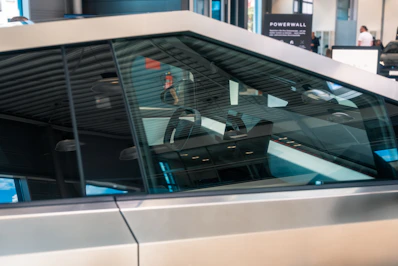 A car parked in front of an airport terminal