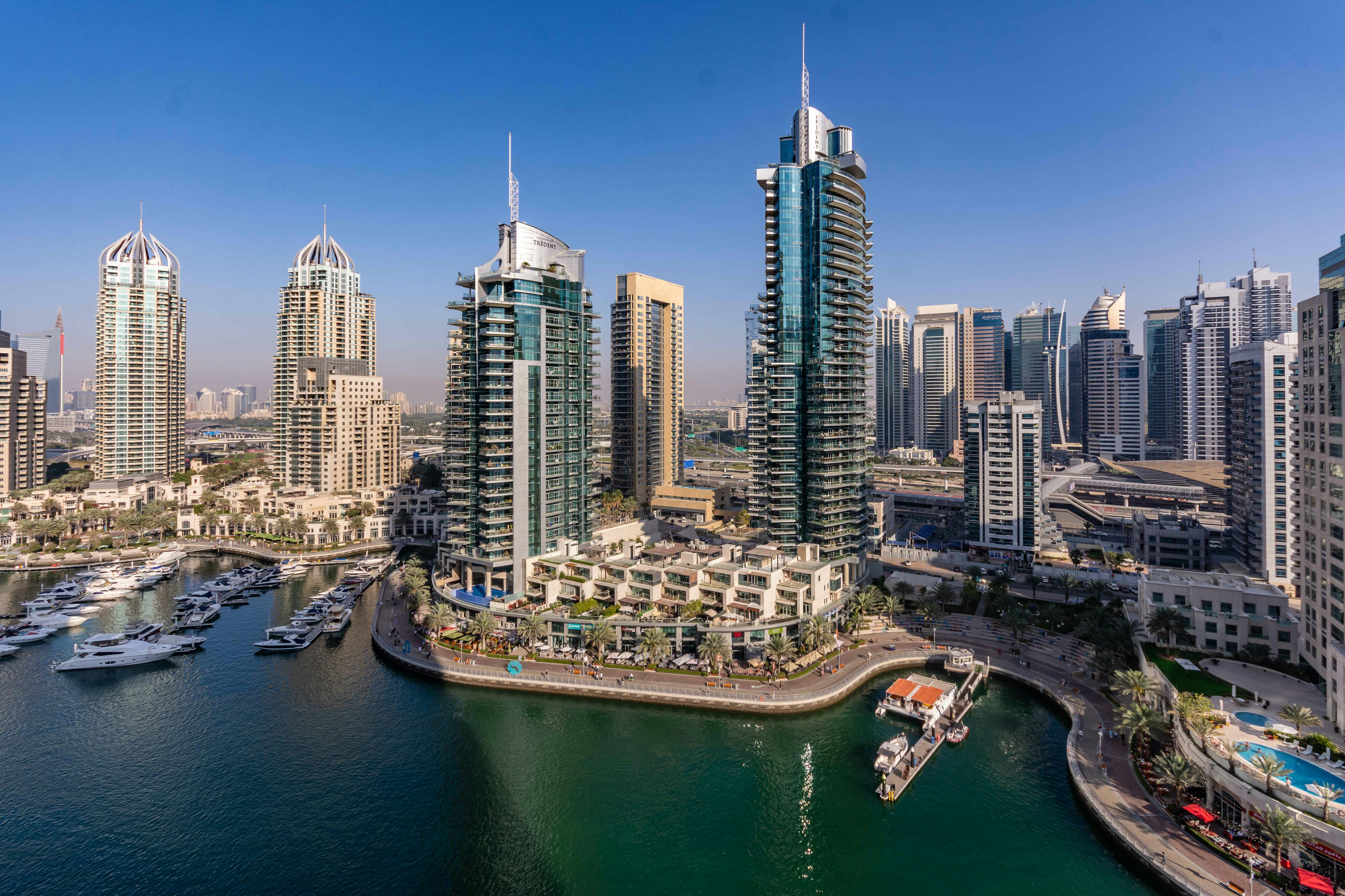 A large body of water surrounded by tall buildings