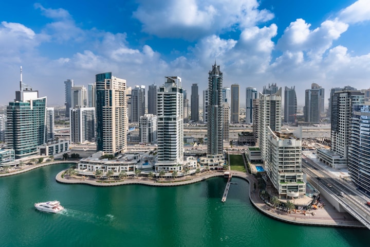 A large body of water surrounded by tall buildings