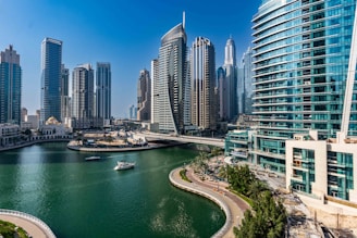 A river running through a city next to tall buildings