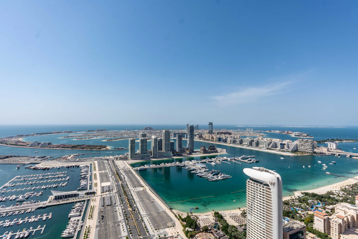 An aerial view of a city with boats in the water