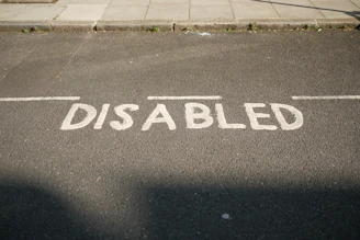 A street sign that reads disabled on the side of the road