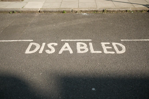 A street sign that reads disabled on the side of the road