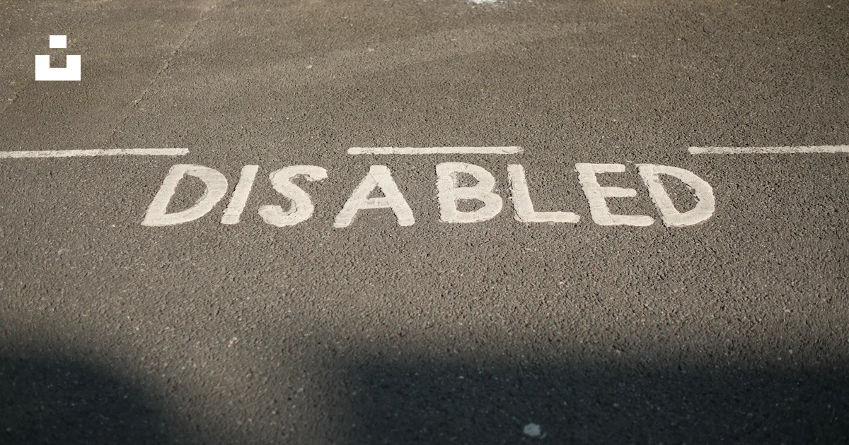 A street sign that reads disabled on the side of the road photo – Free ...