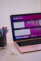 A laptop computer sitting on top of a desk