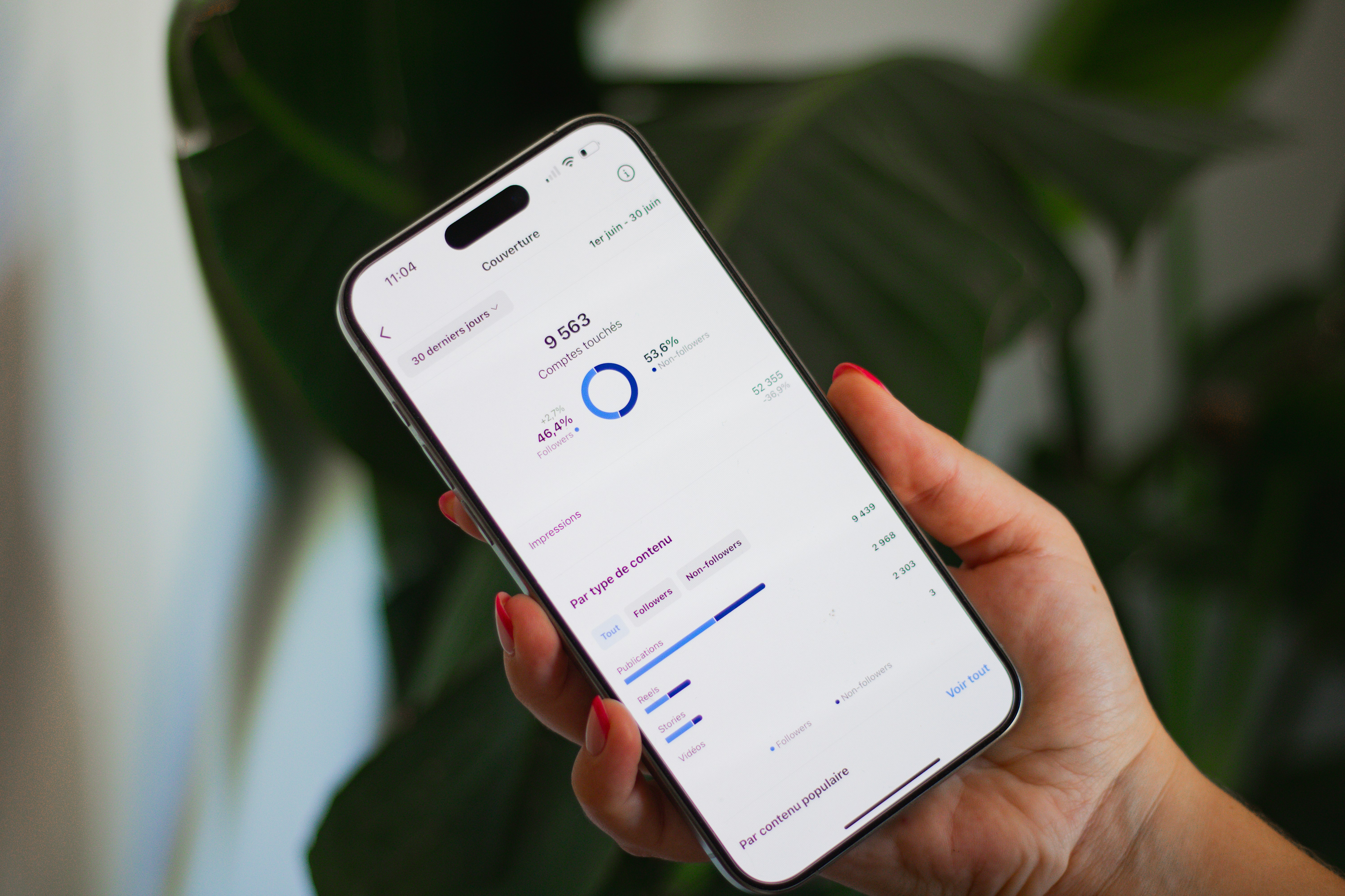 A person holding a cell phone in their hand