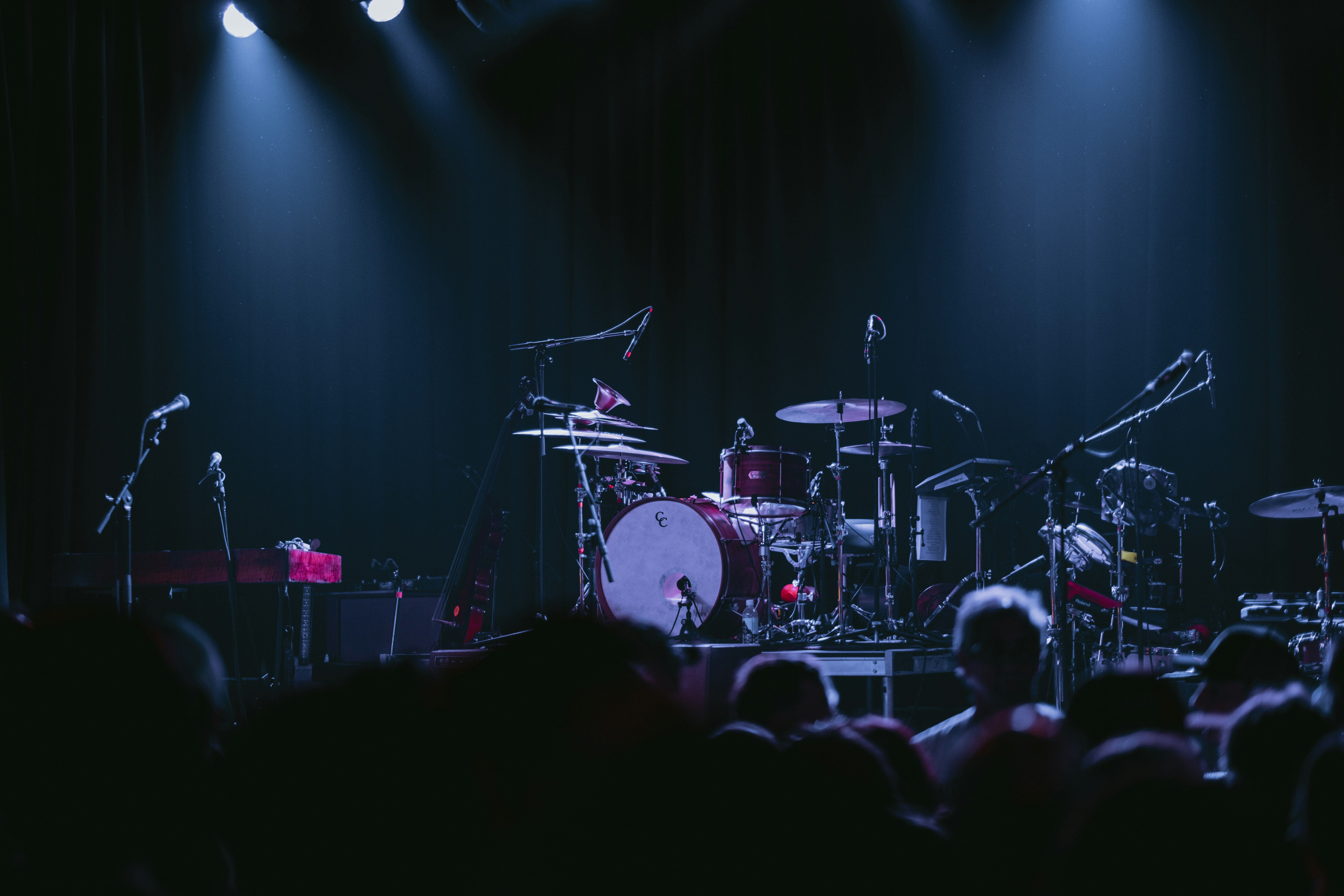 A band playing on stage in front of a crowd