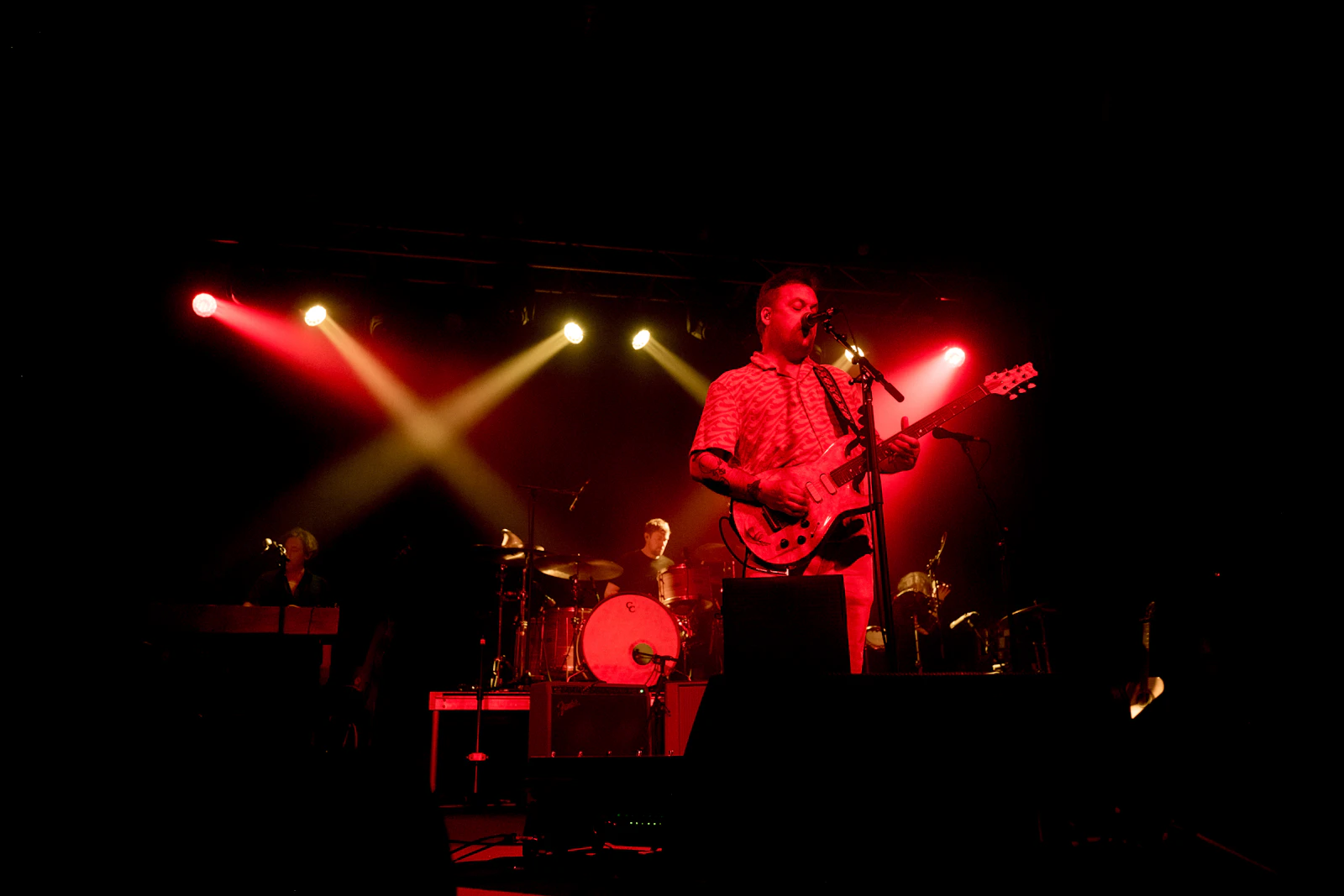 Independent musician performing on a live stage
