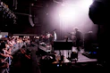 A group of people that are standing on a stage