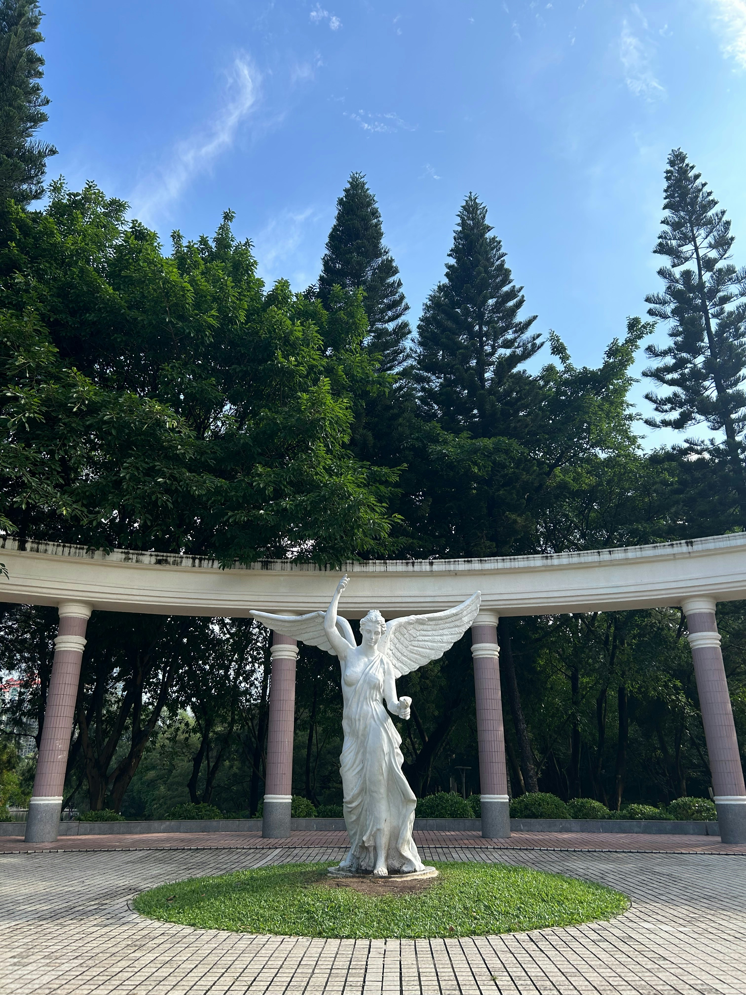 A statue of a woman with a bird on her shoulder photo – Free Forest ...