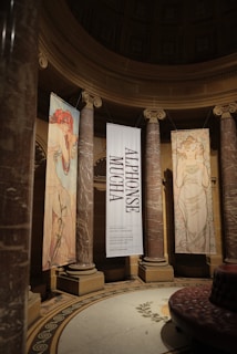 A room with a lot of pillars and banners