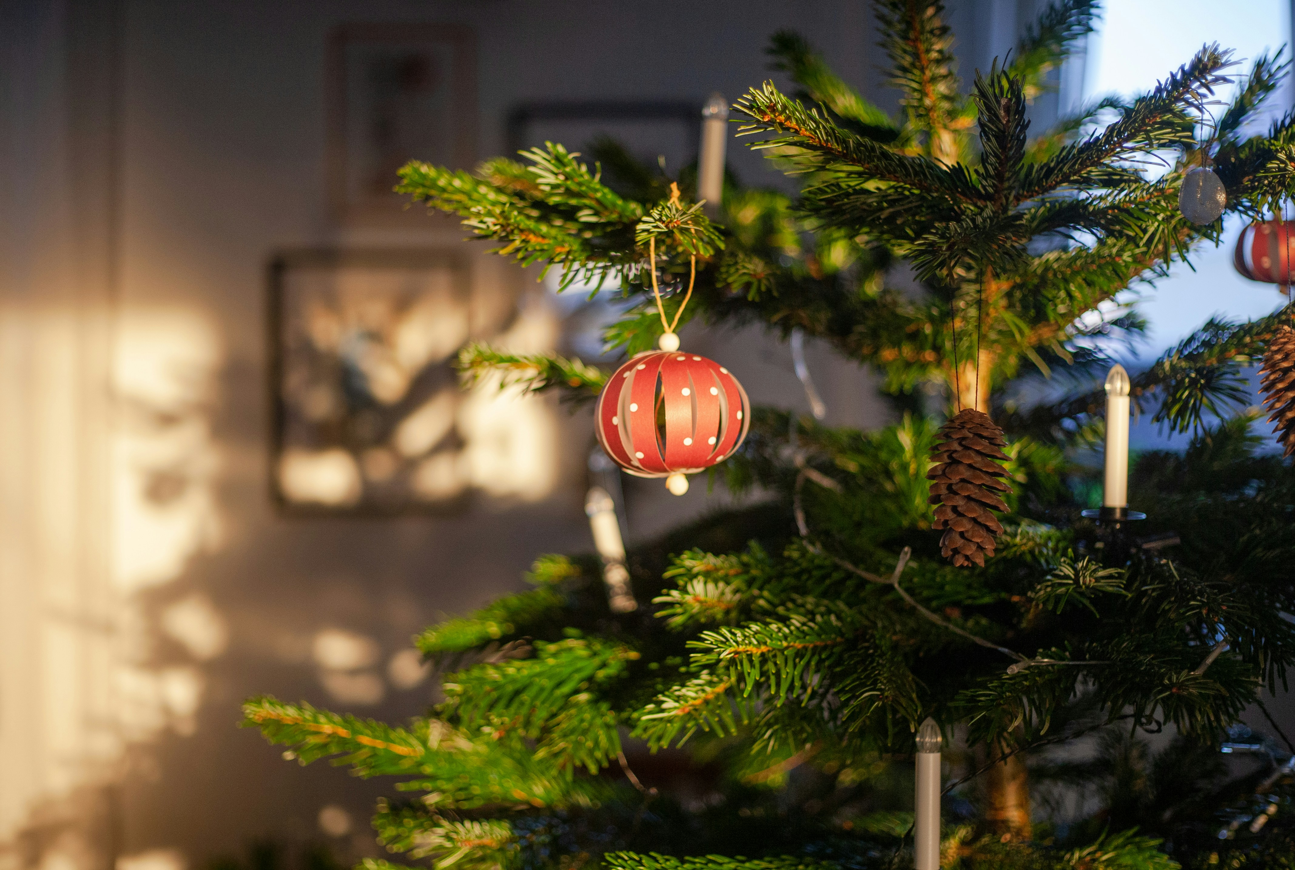 A christmas tree with ornaments hanging from it