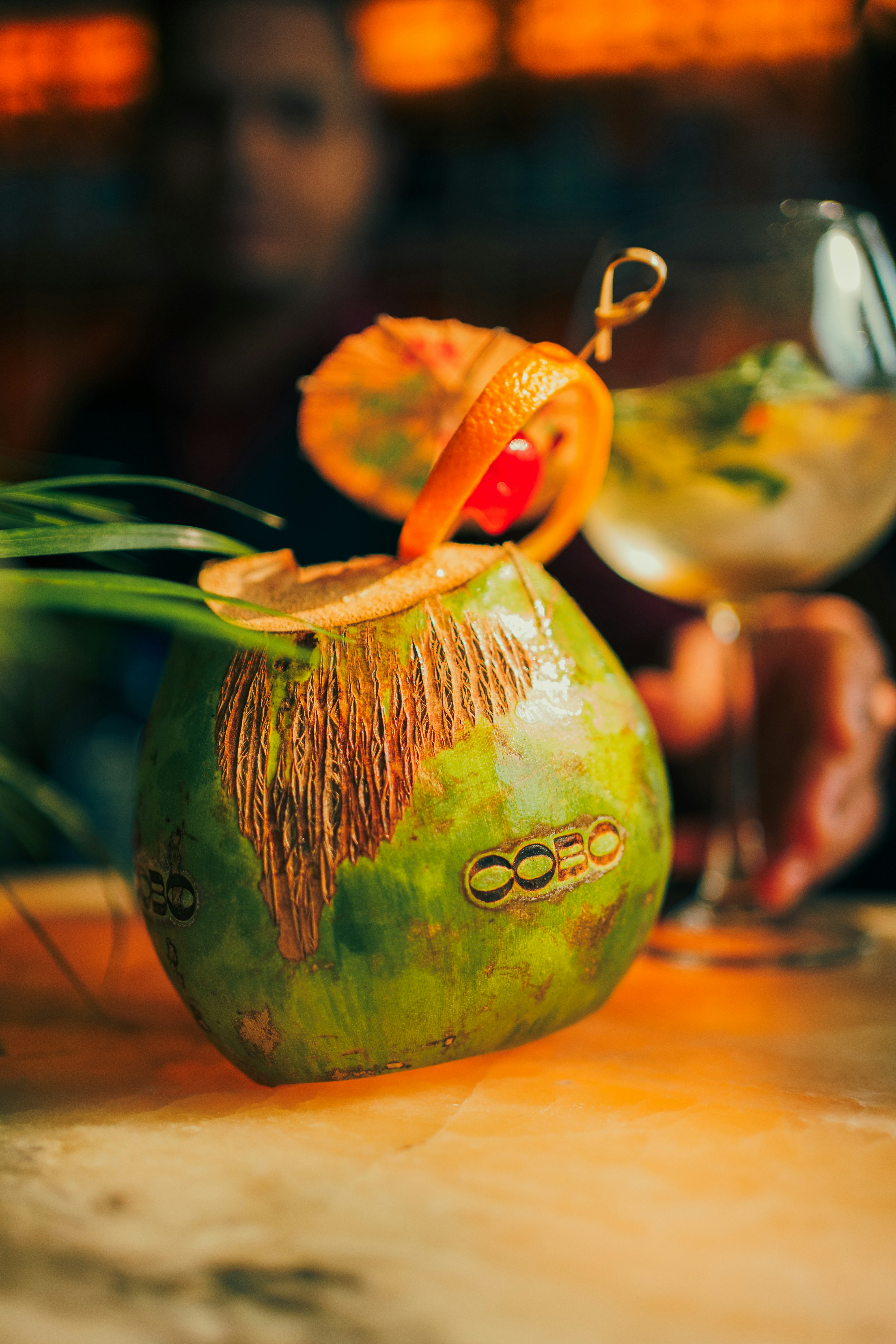 A close up of a drink in a glass on a table