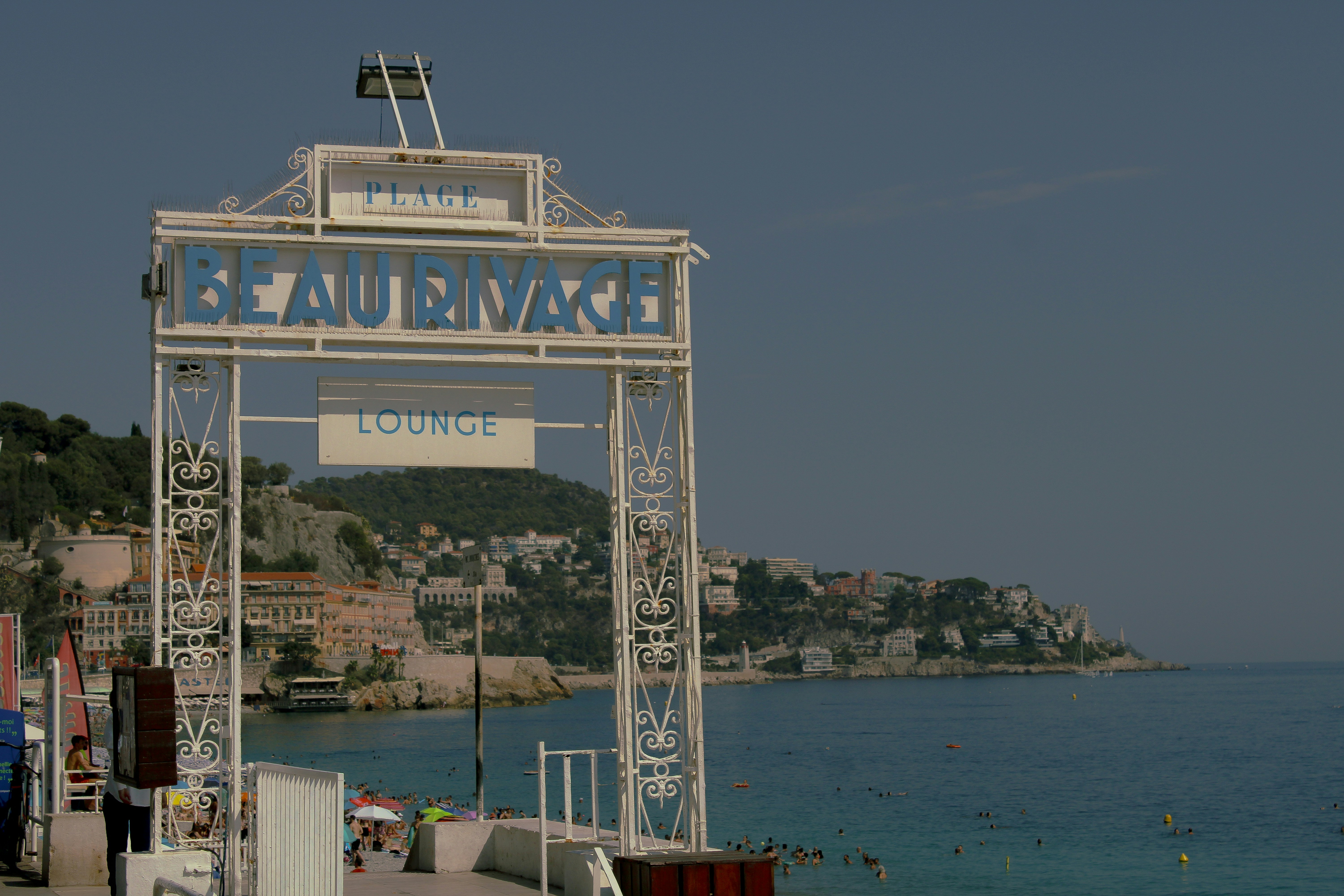 A sign that is on the side of a road