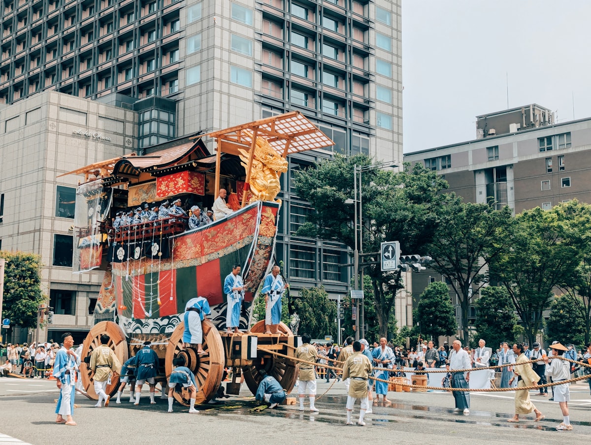 Kyoto July — towering Gion Matsuri yamaboko festival float positioned in a city street
