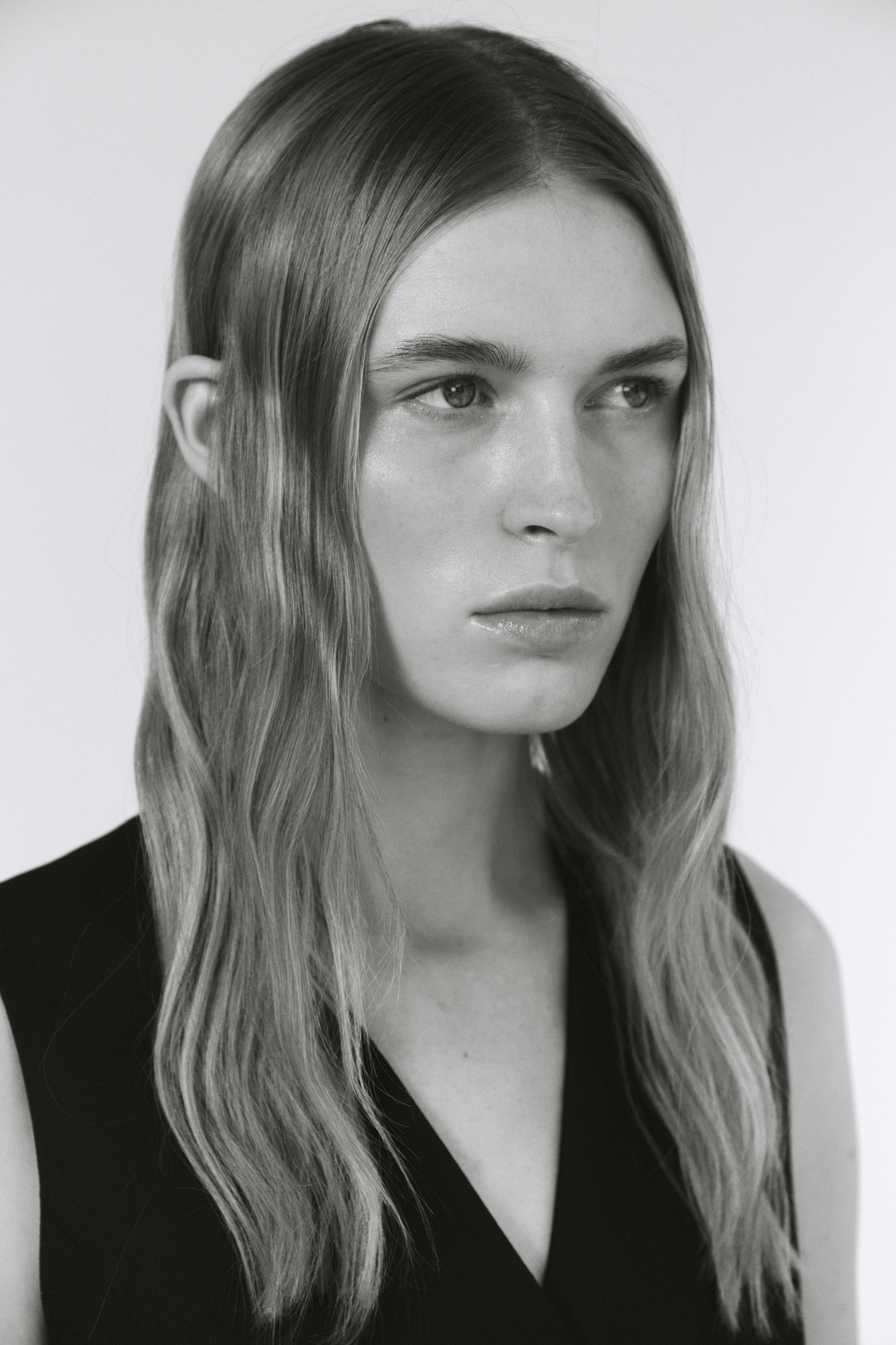 A black and white photo of a woman with long hair photo – Free Portrait ...
