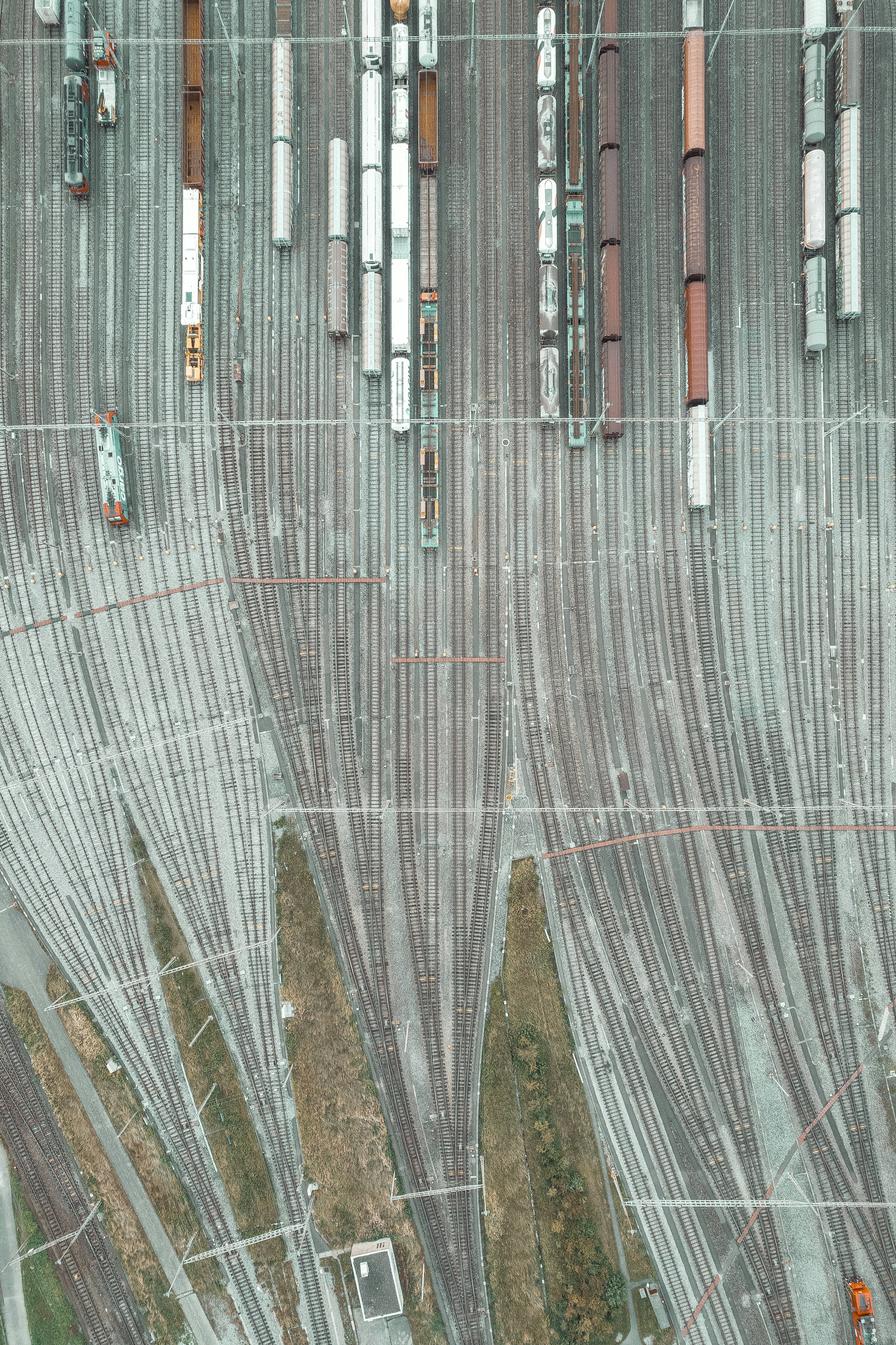 An aerial view of a train yard with many trains