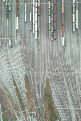 An aerial view of a train yard with many trains