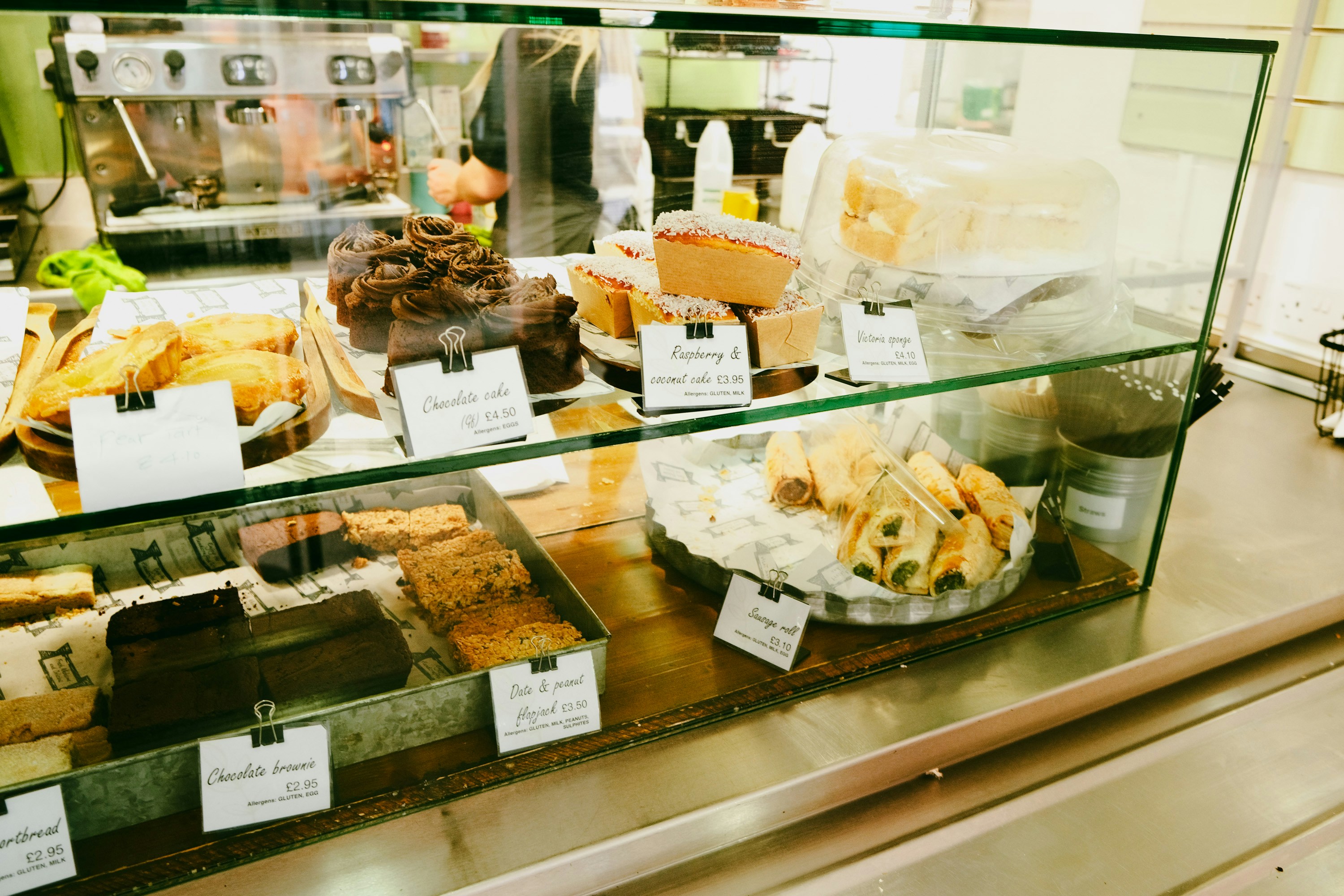 A display case filled with lots of different types of food