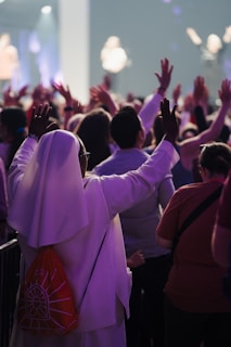 A large group of people standing in front of a crowd