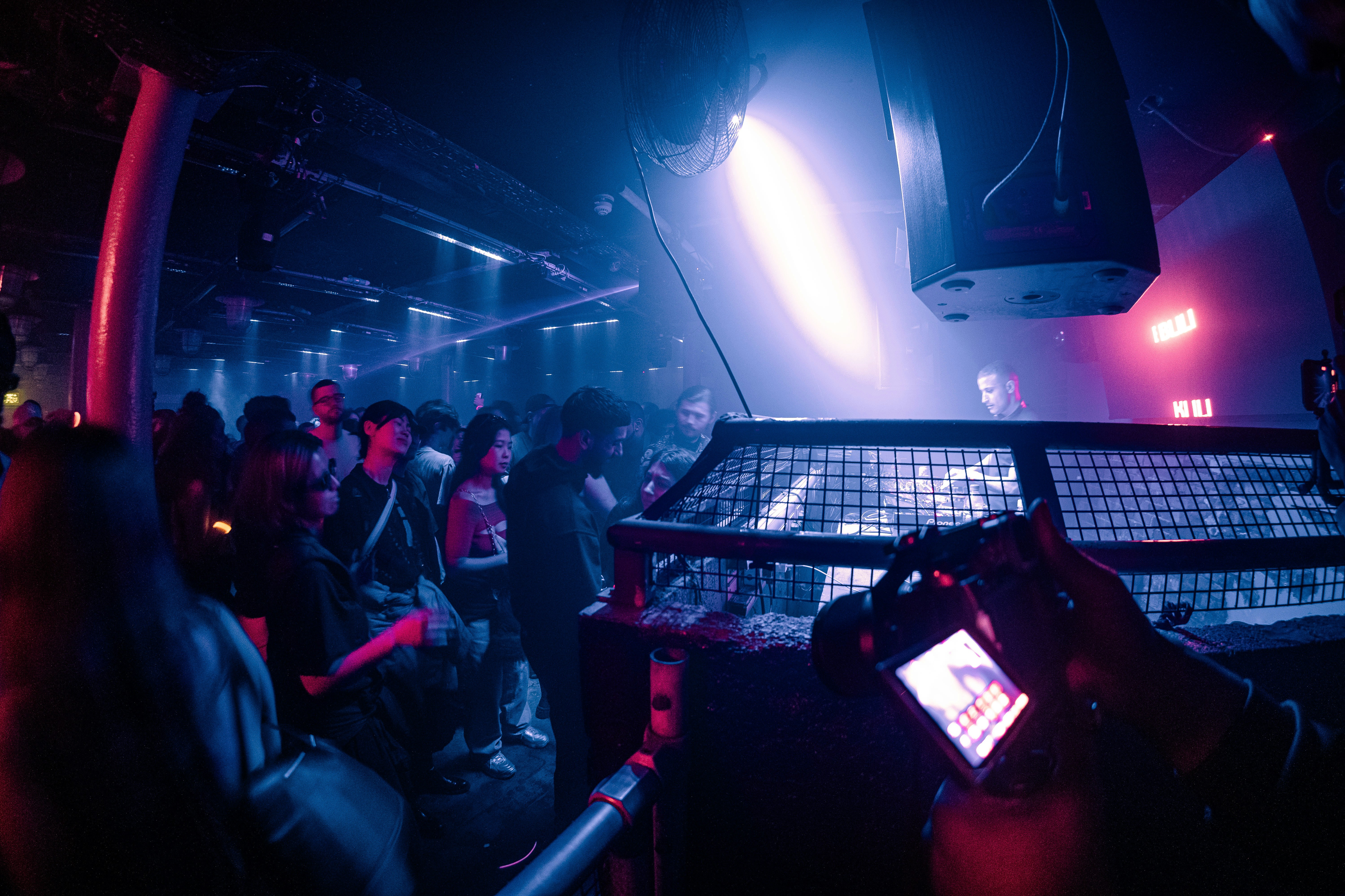 A group of people sitting in a dark room
