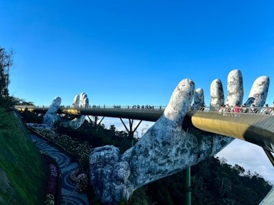 Golden Bridge held by giant stone hands at Ba Na Hills Da Nang