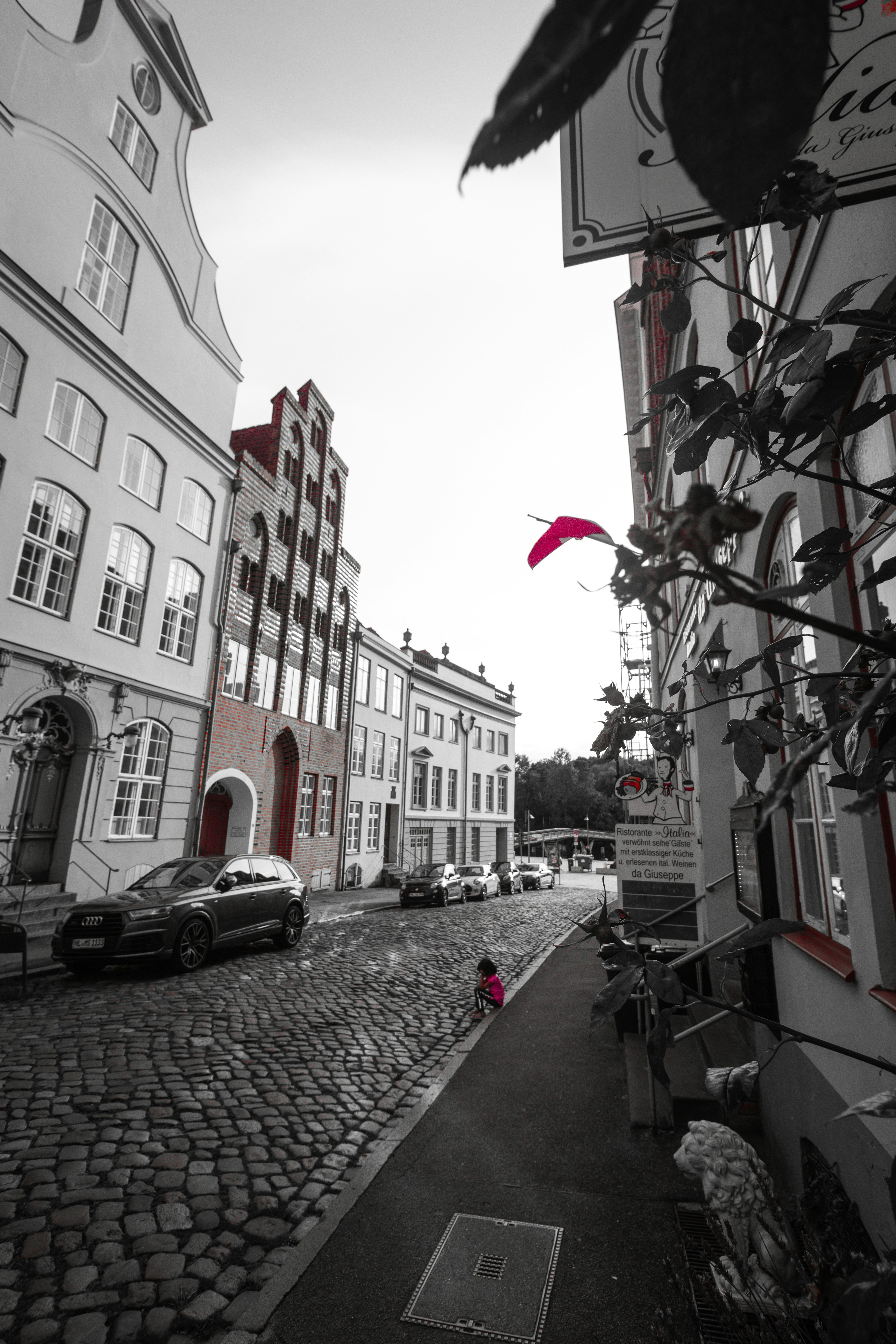 A black and white photo of a cobblestone street