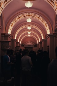 A group of people standing in a hallway