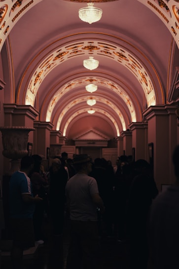 A group of people standing in a hallway