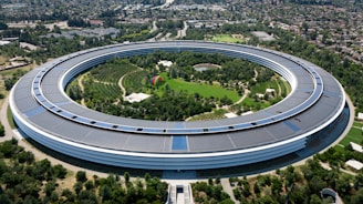An aerial view of a building with a circular roof