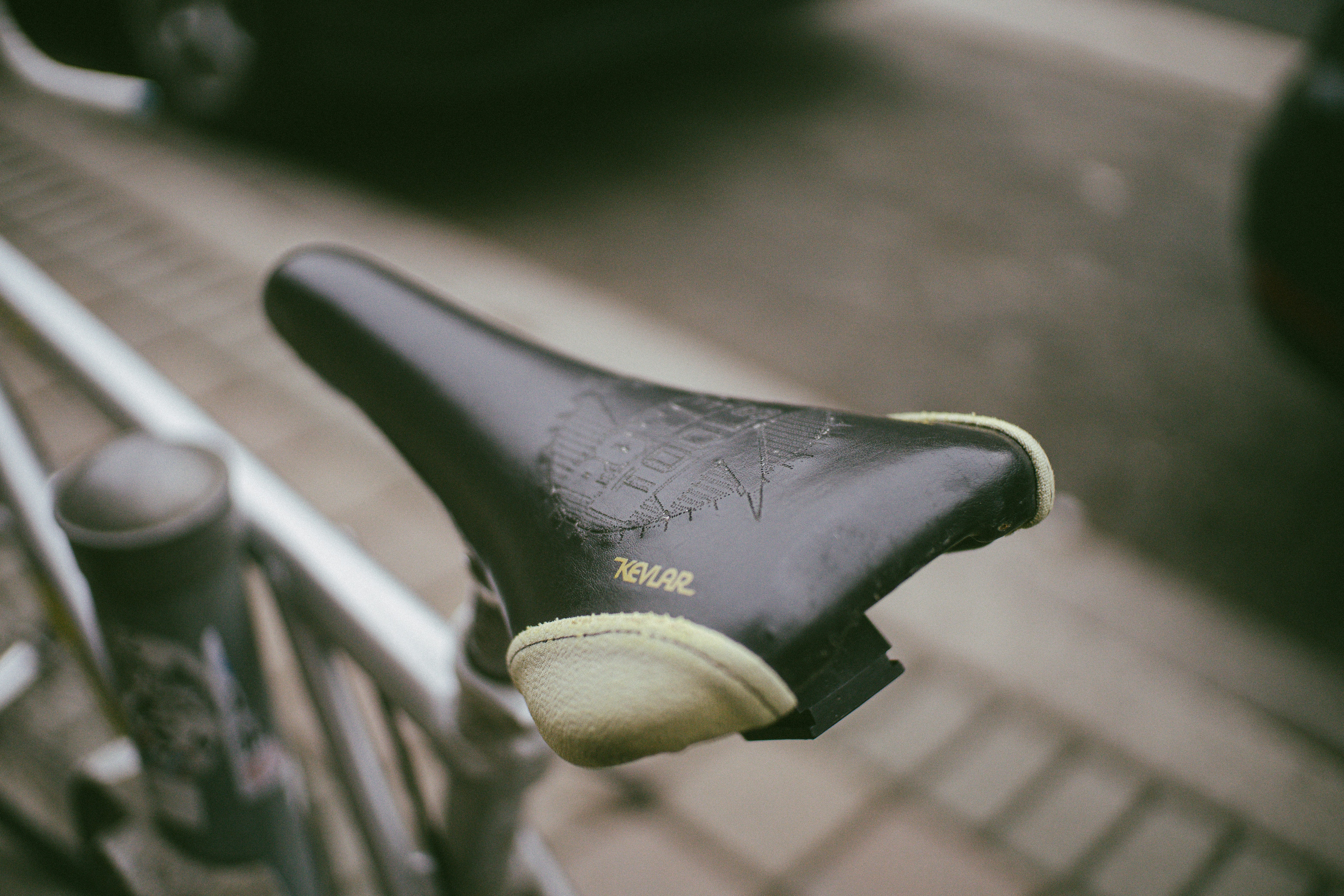 A close up of a bicycle seat on a bike