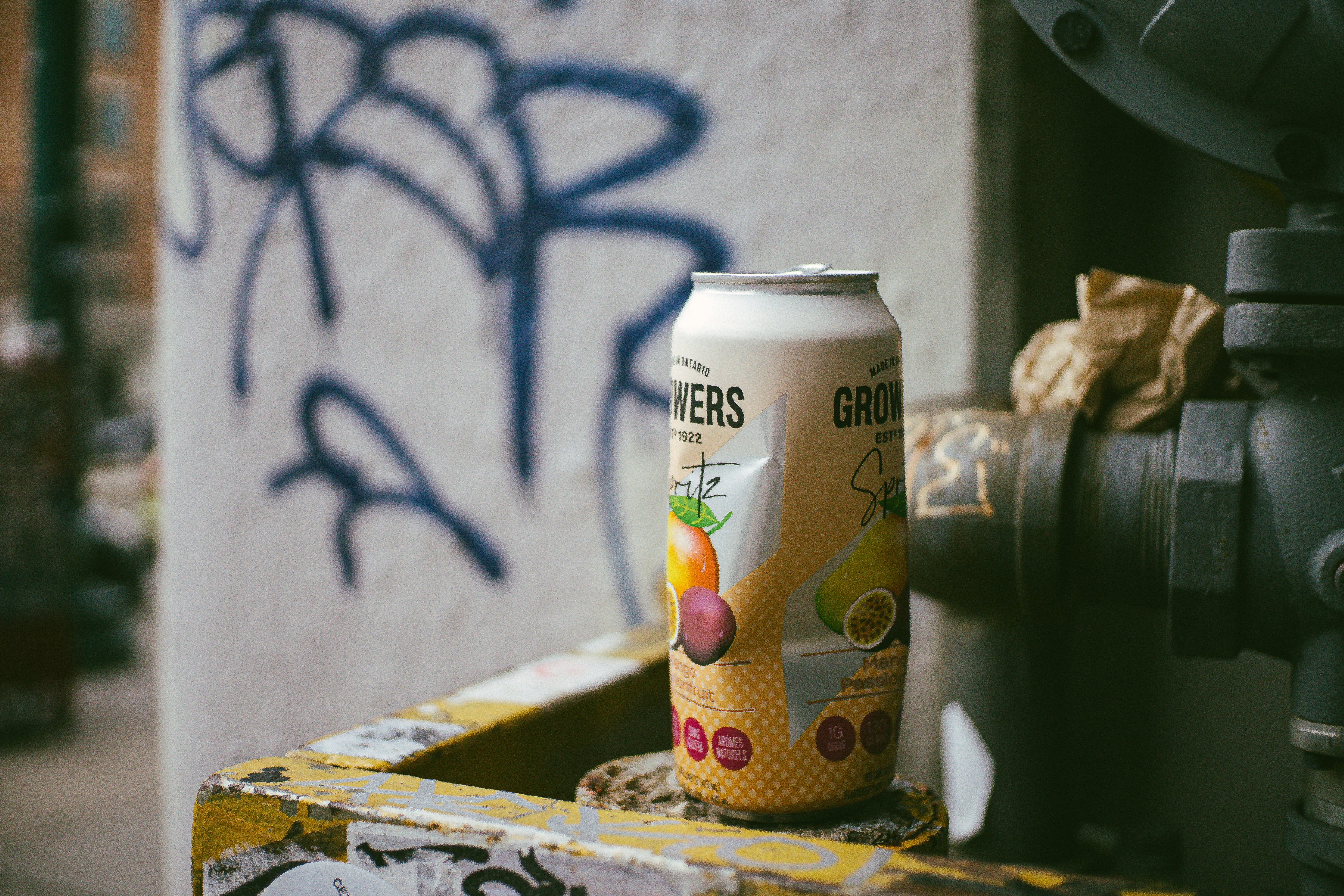 A can of beer sitting on top of a box
