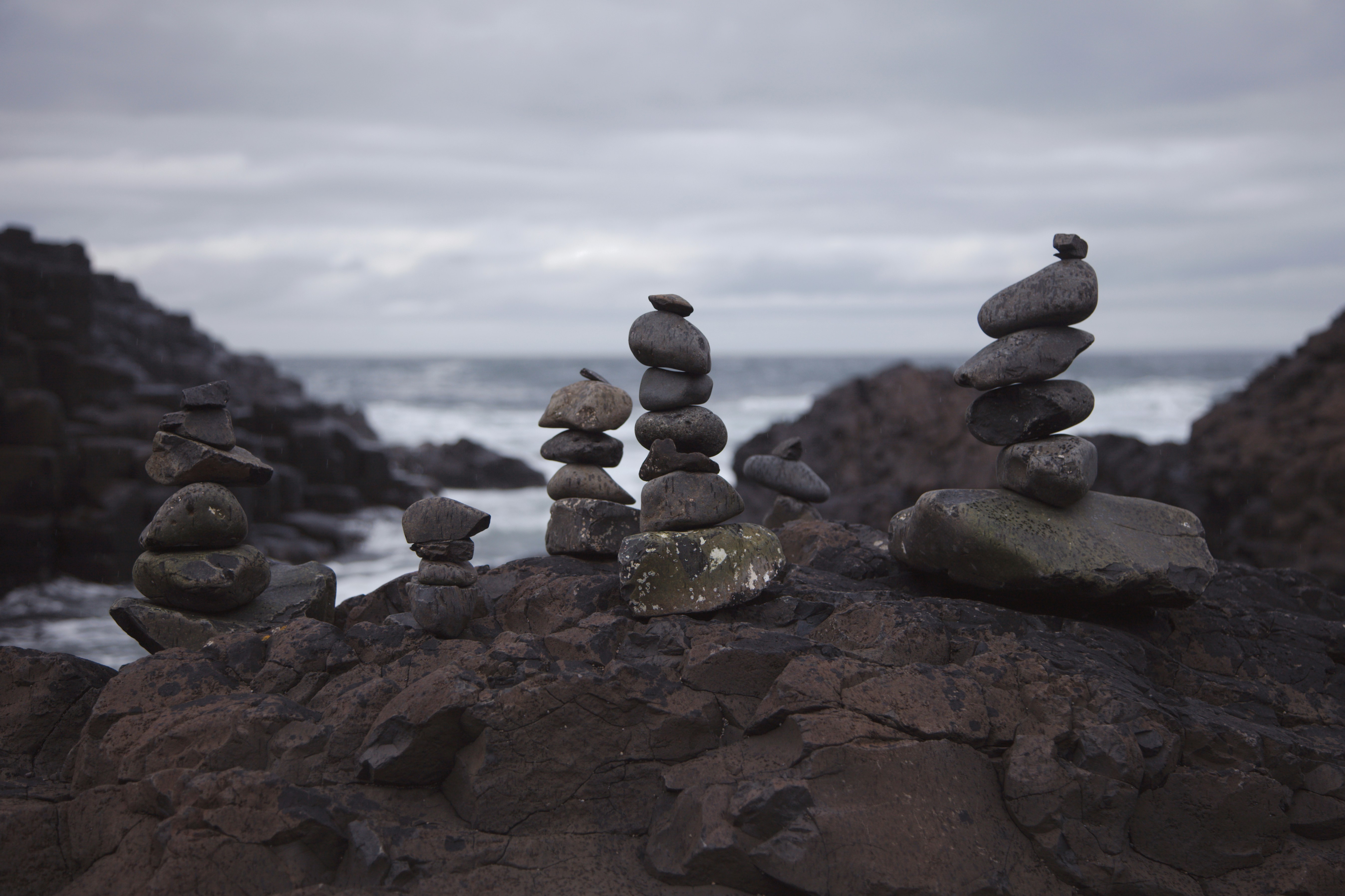 A pile of rocks sitting on top of a rocky beach