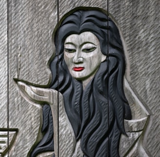 A statue of a woman with long black hair
