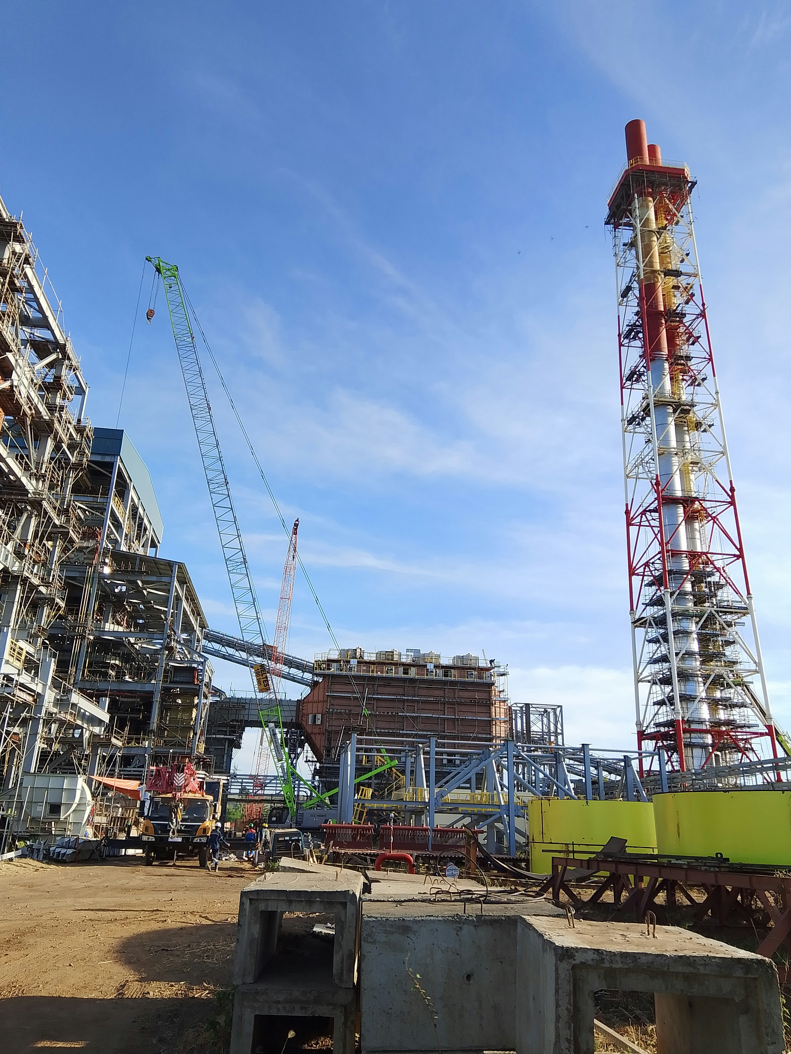 A construction site with a crane and a building under construction