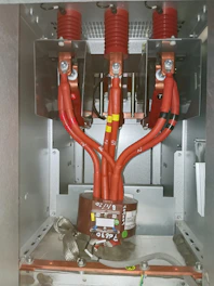 A close up of an electrical box with wires