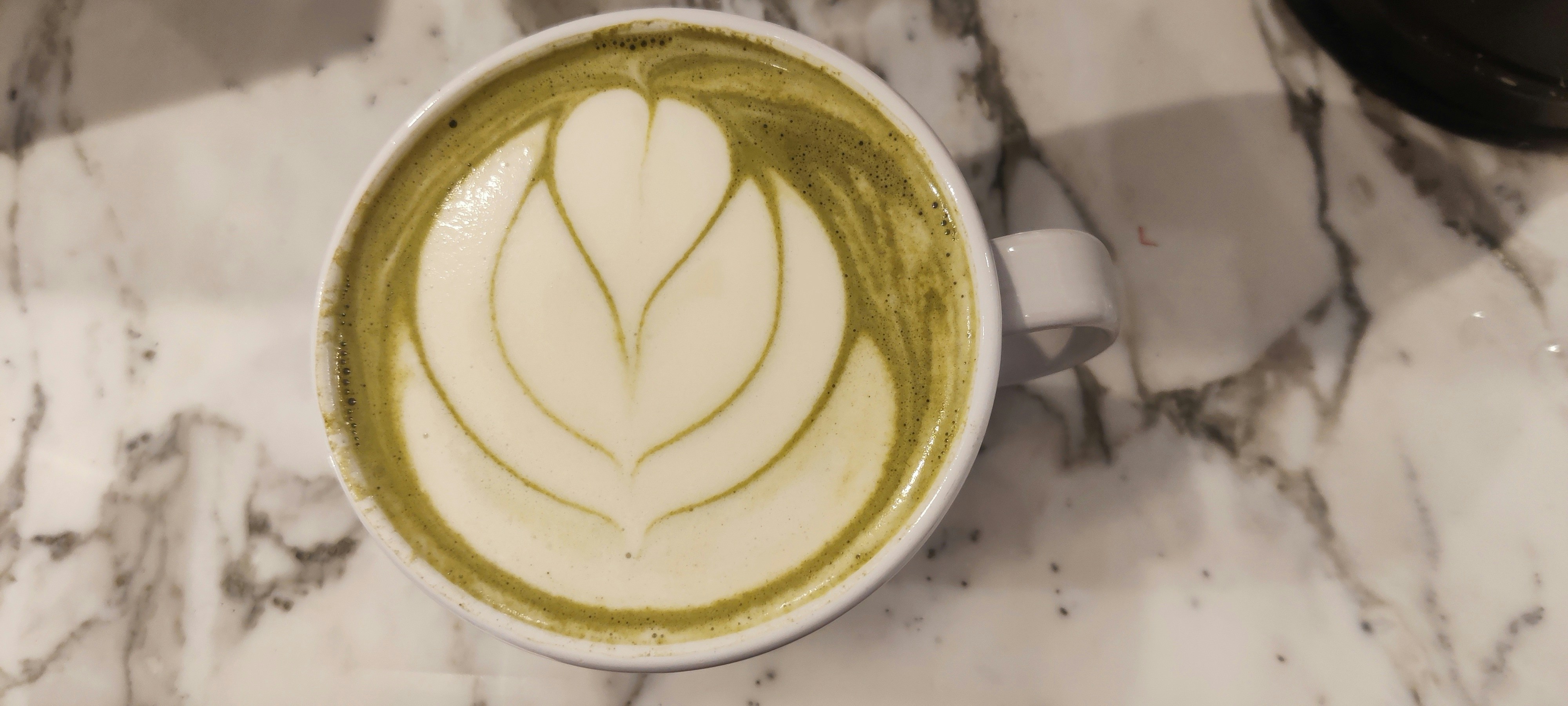 A cup of coffee on a marble table