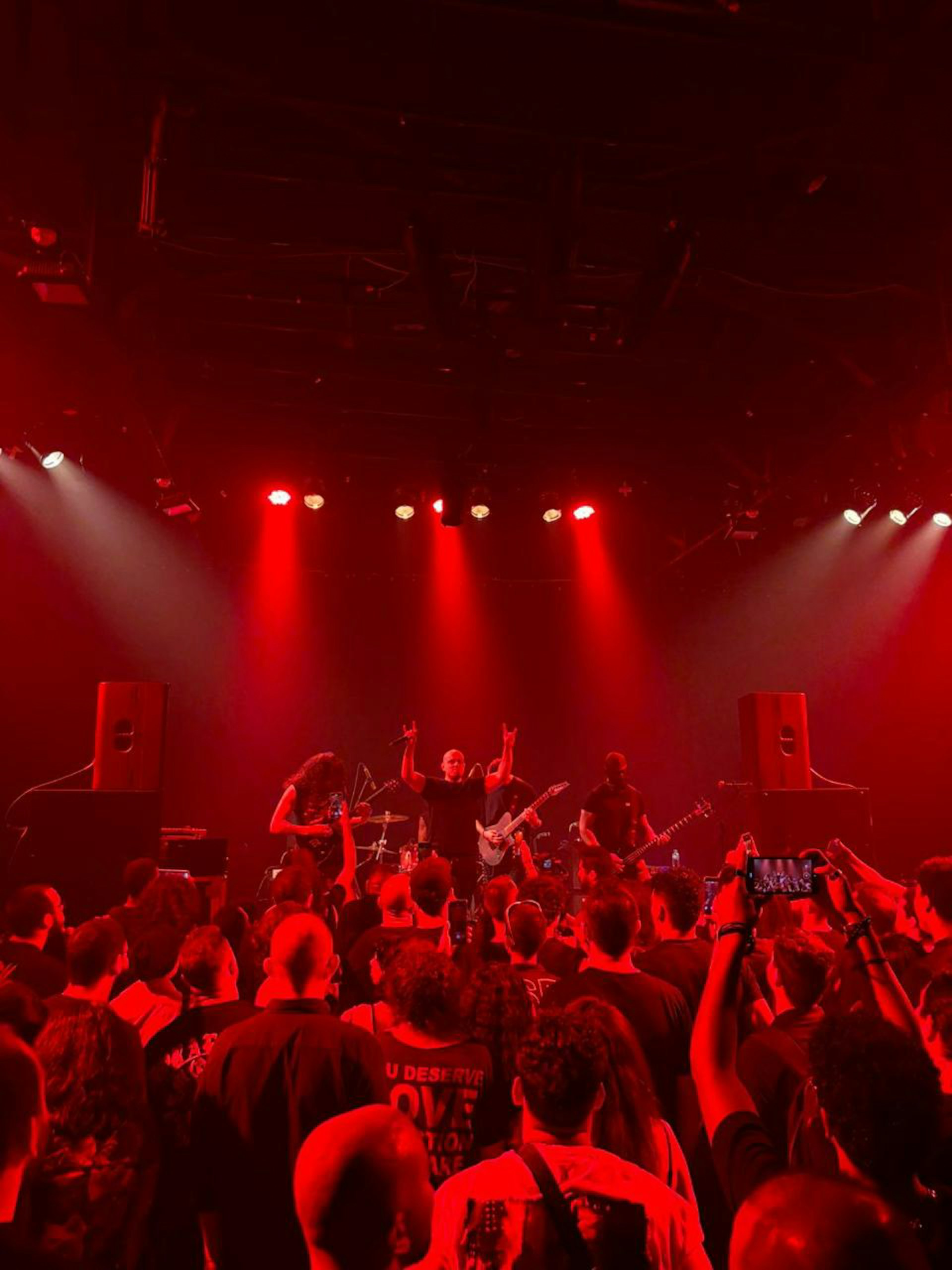 A group of people that are standing in front of a stage