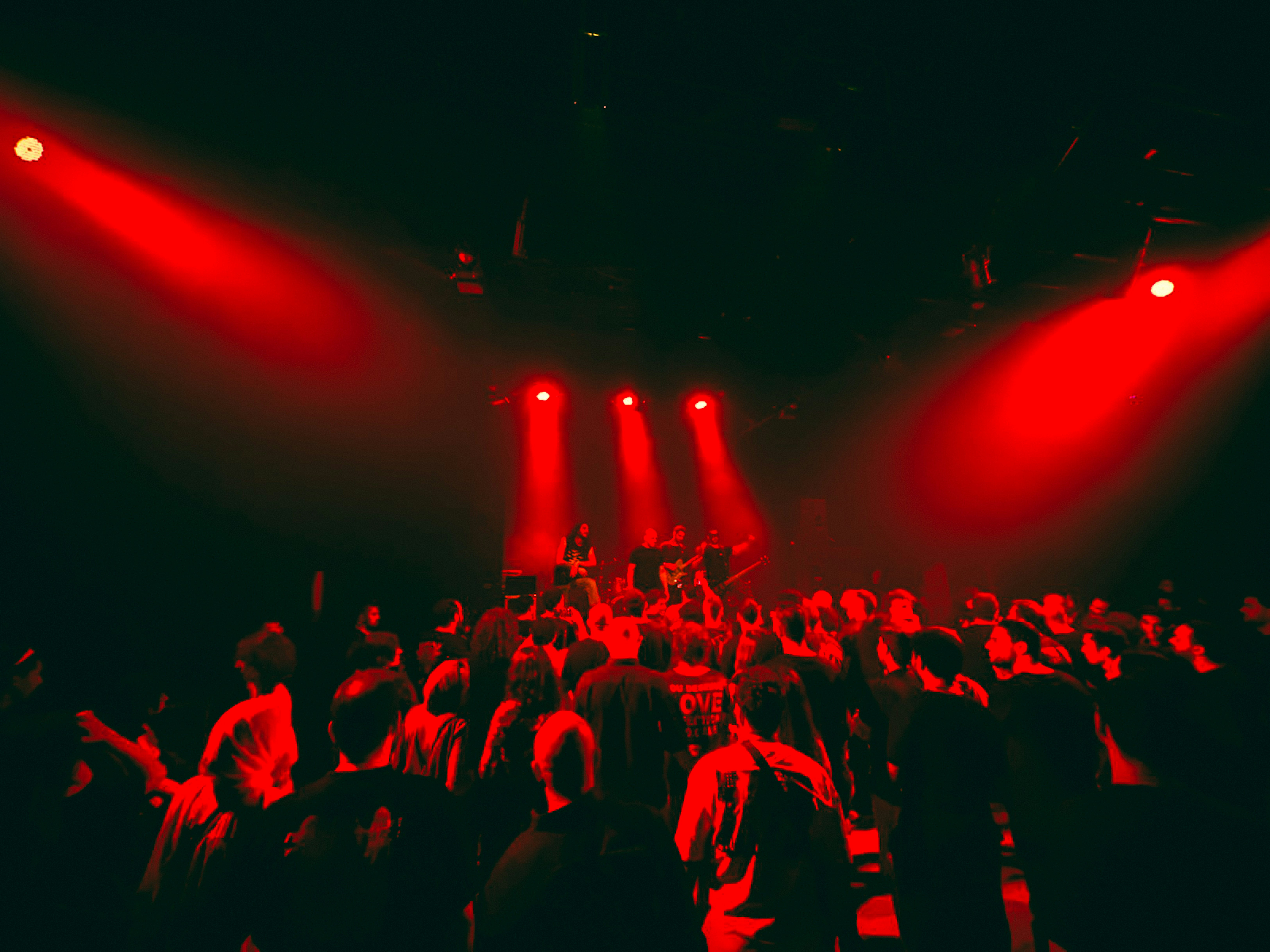 Festival crowd watching a large stage at night