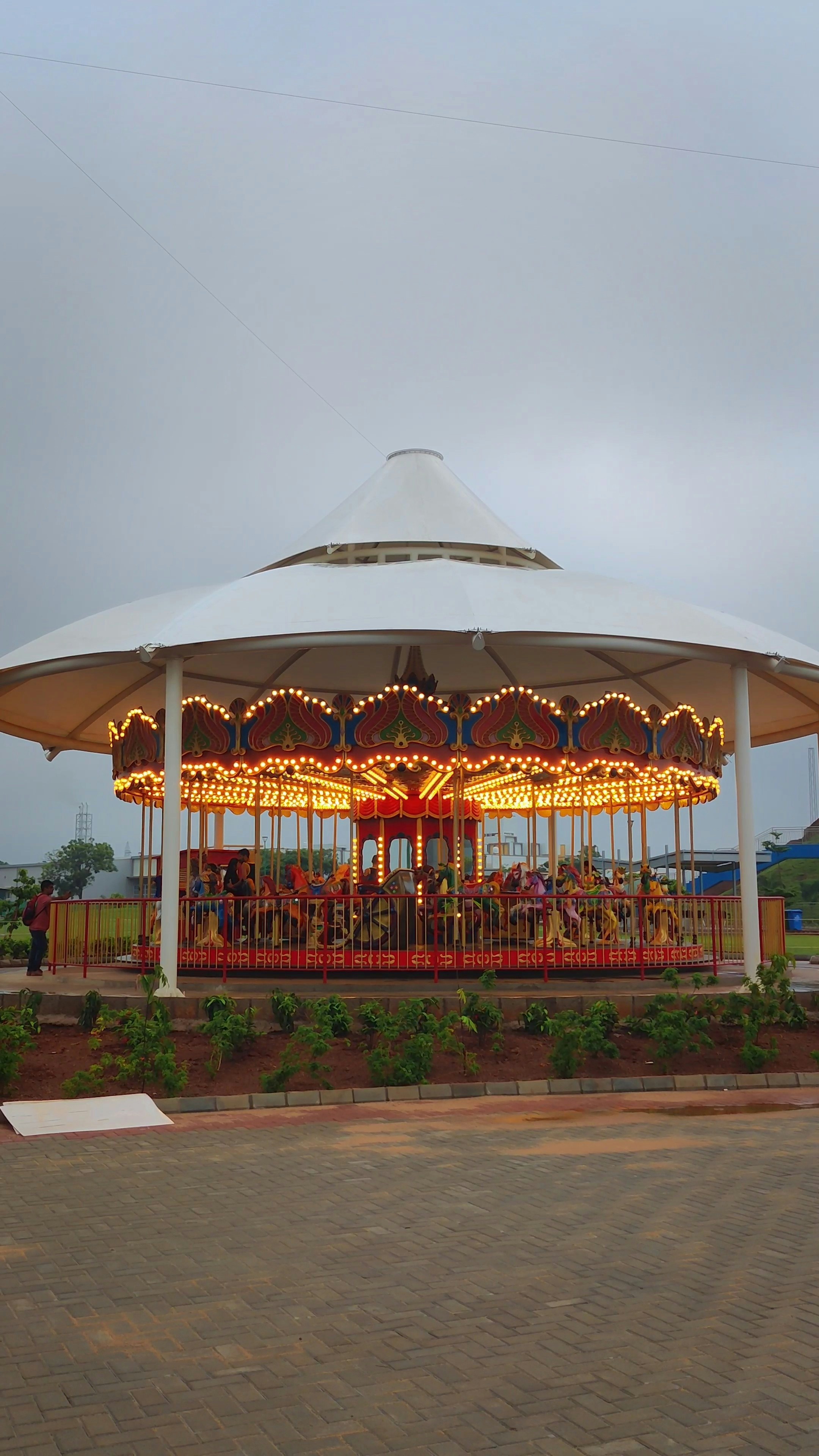 A merry go round on a cloudy day