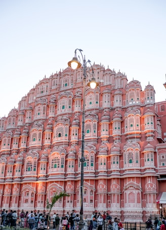 A large pink building with lots of windows
