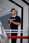 A man standing in front of a mirror wearing glasses