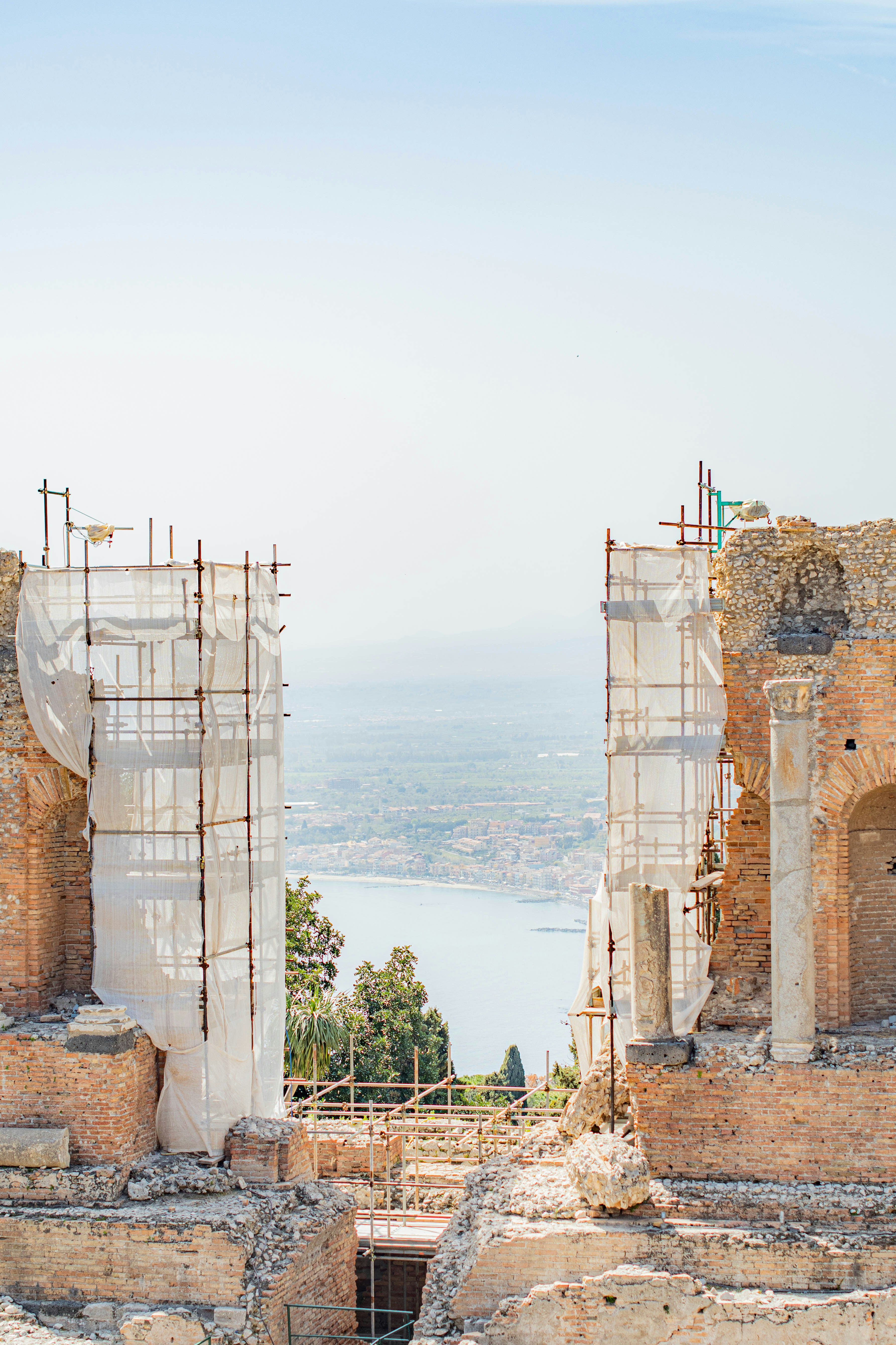 The ruins of a building with scaffolding around it