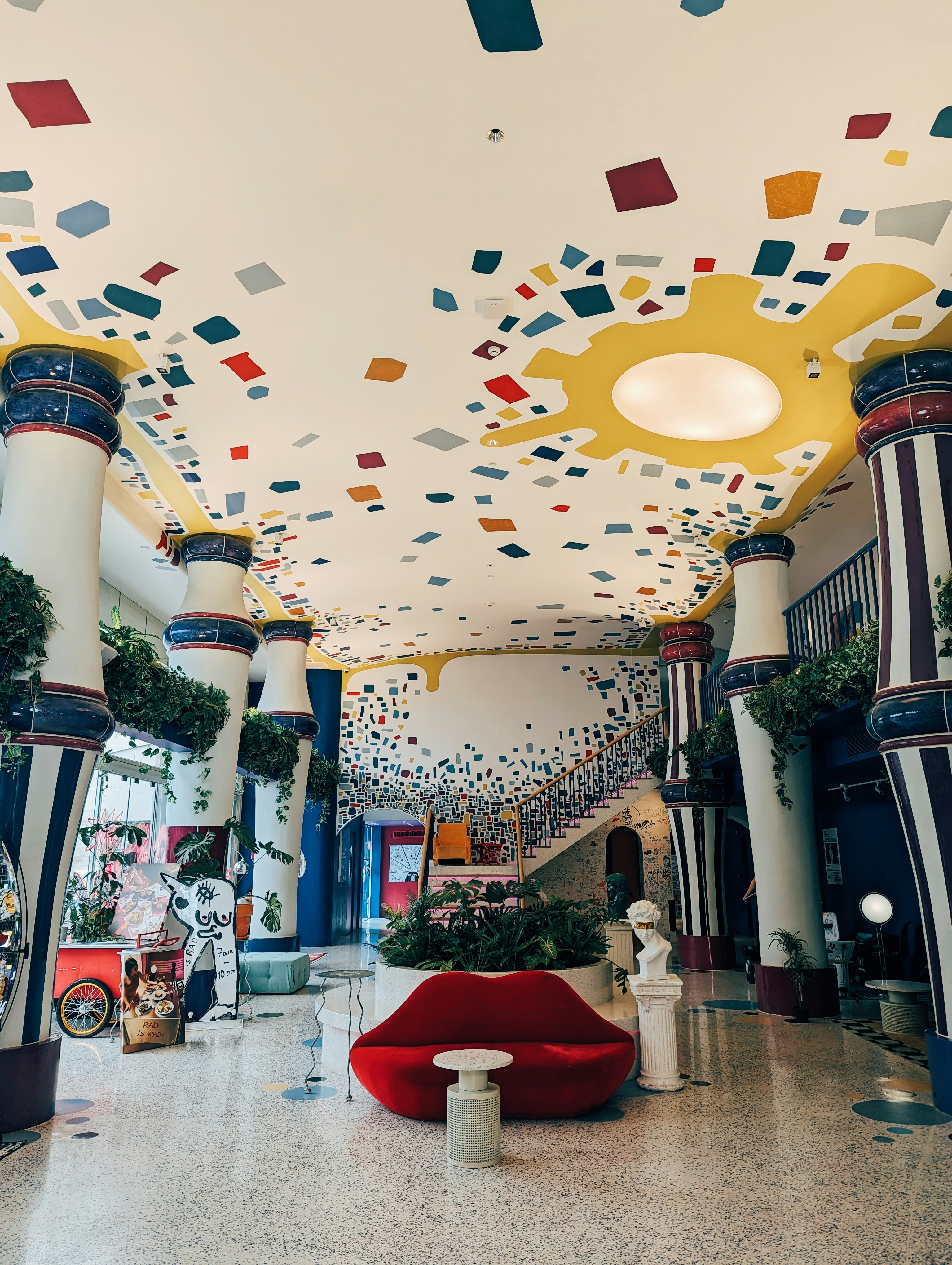 A large room with a lot of colorful decorations on the ceiling