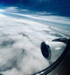 A view of the wing of an airplane in the sky