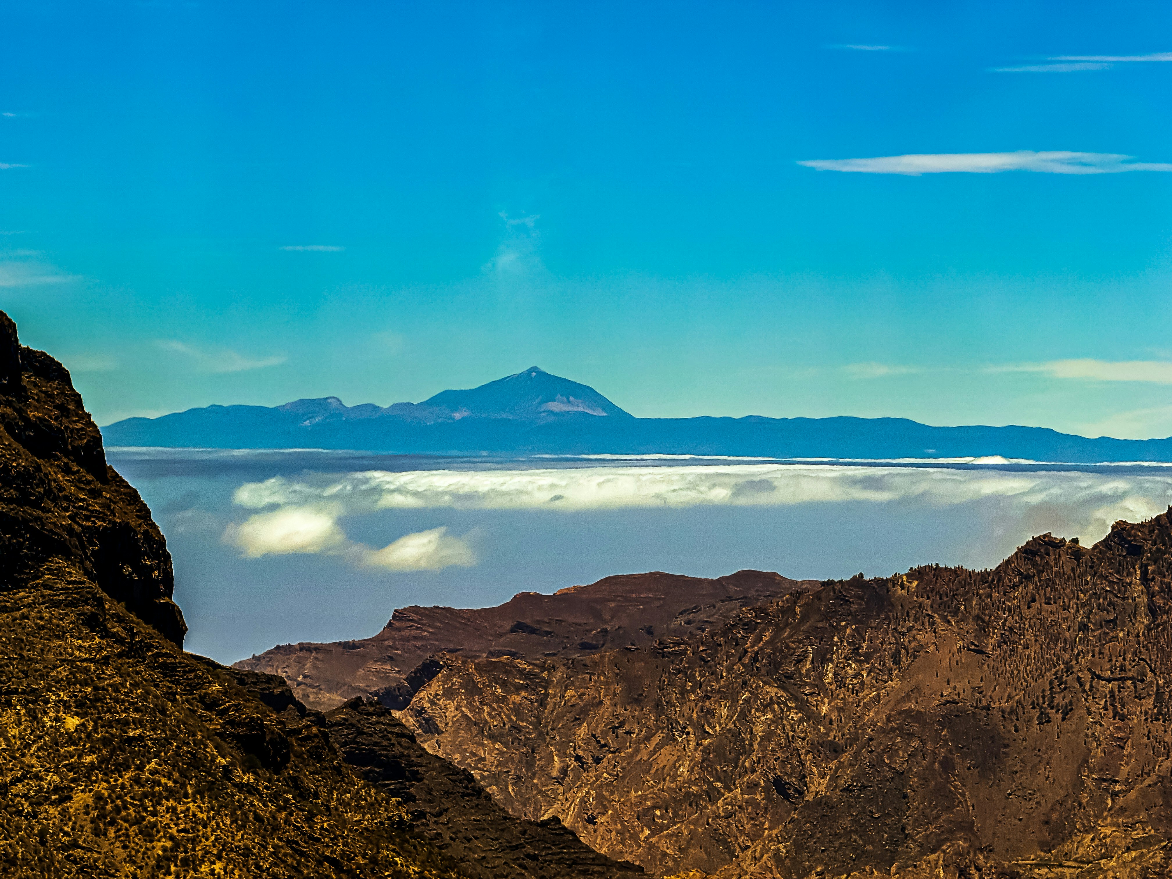 A view of mountains and clouds from a high point of view