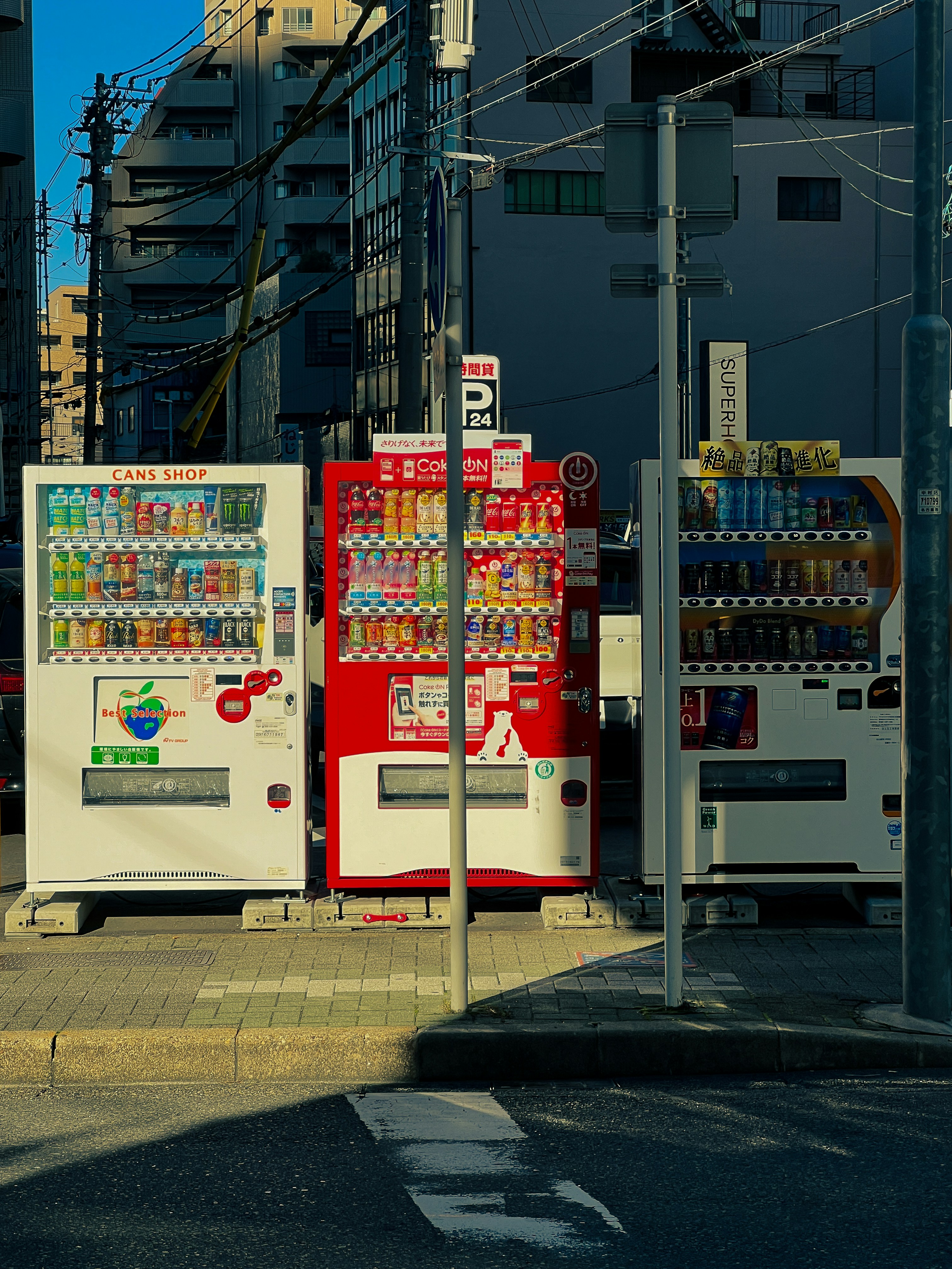 A row of vending machines sitting on the side of a road