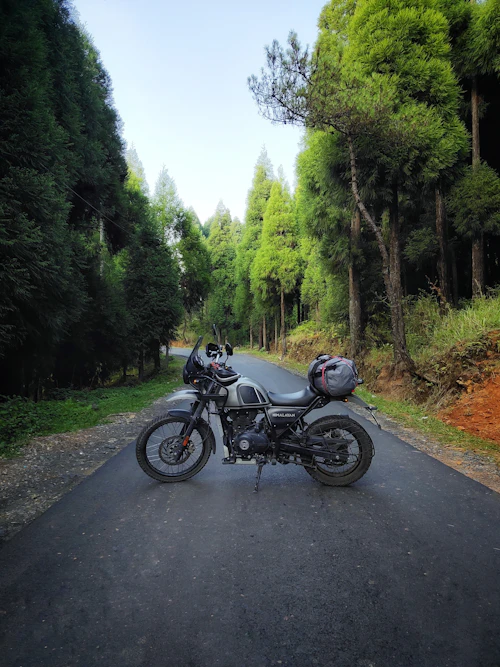 Motorcycle parked beside a mountain road on a Himalayan expedition