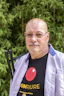 A man with a t - shirt that says compure on it