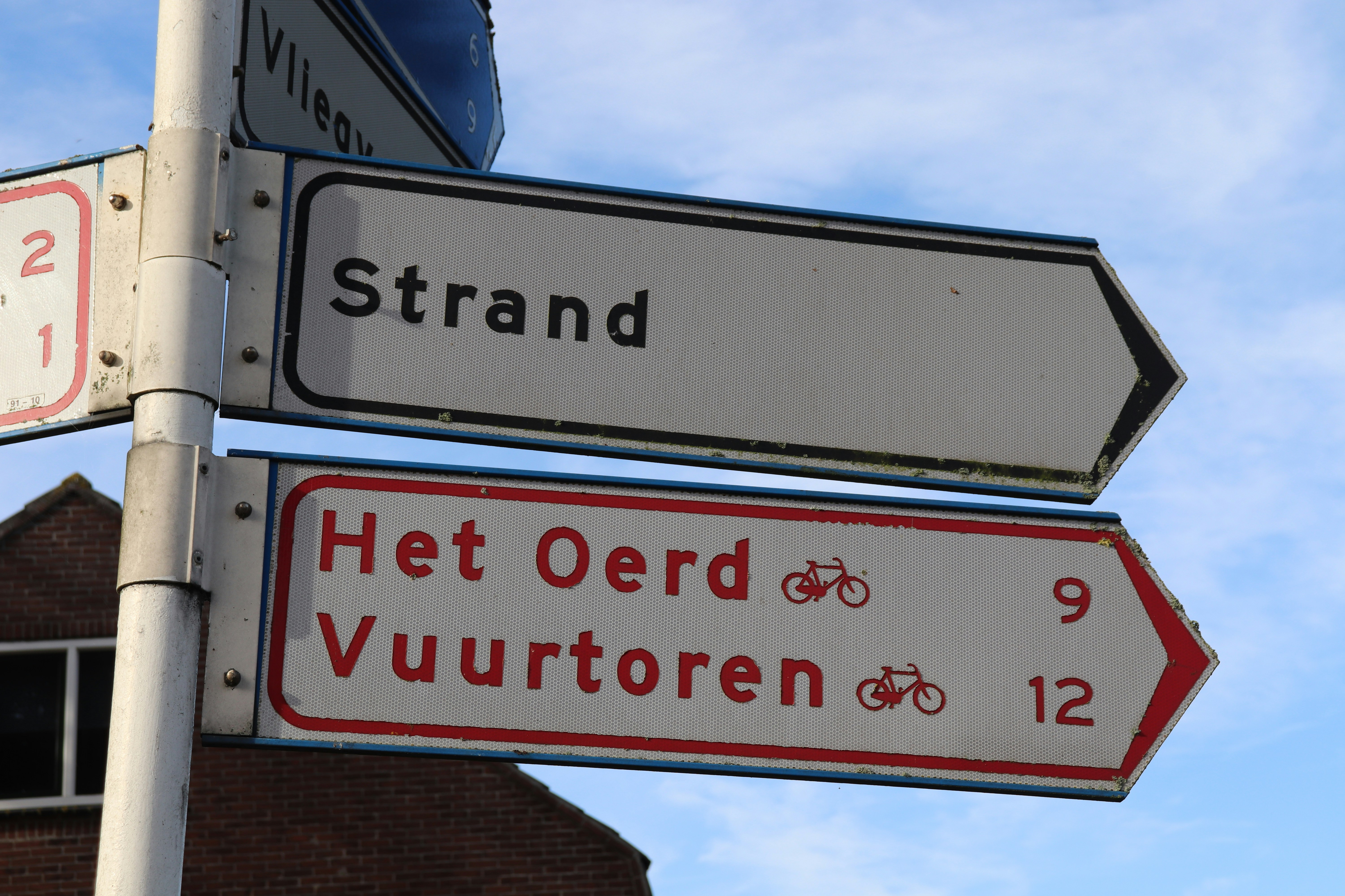 A street sign with a building in the background